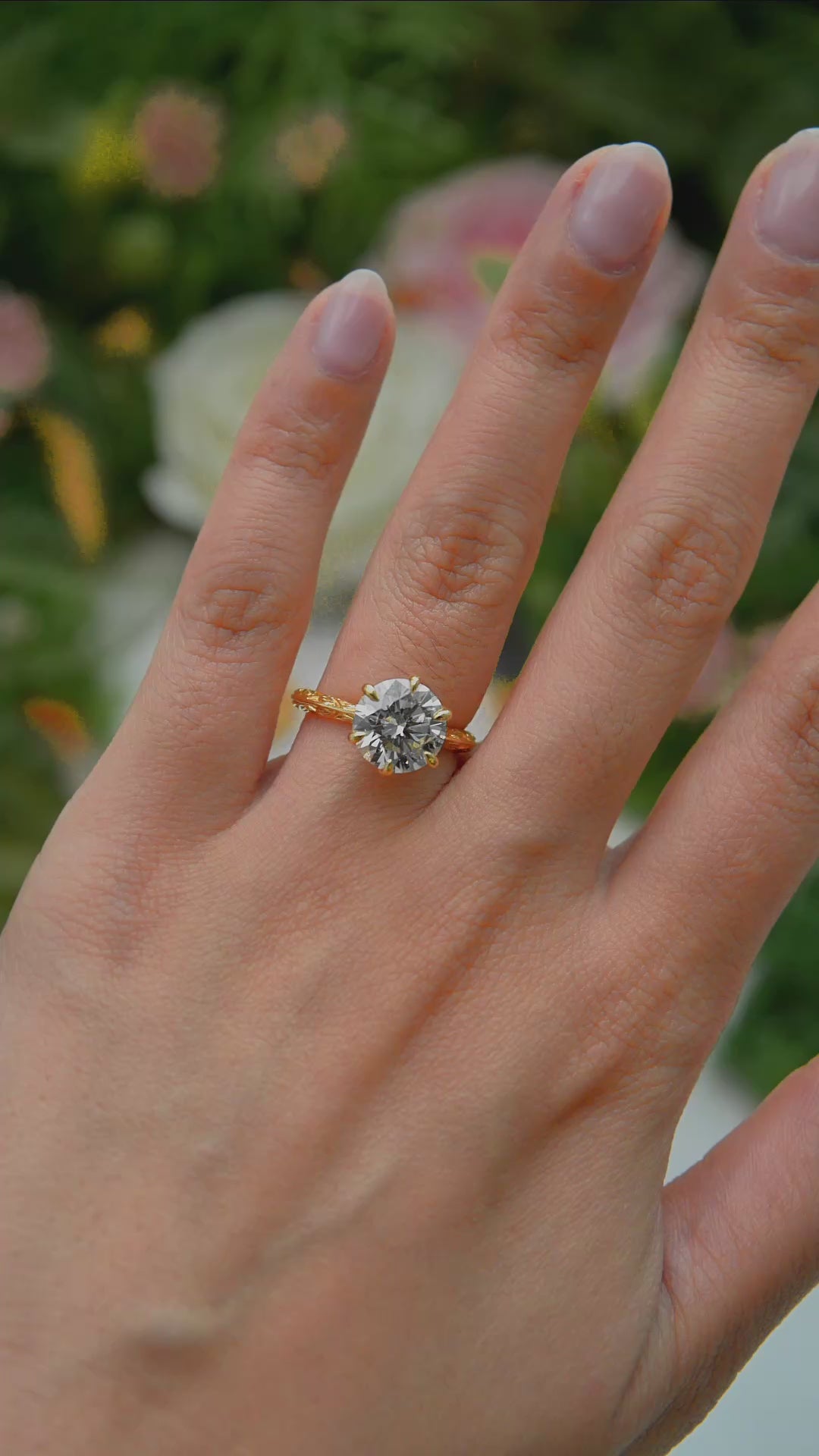 Load and play video in Gallery viewer, LUCCE Leaf Motif Carved Knife Edge Cathedral Round Diamond Solitaire Engagement Ring with Overlapping Petal Prongs in Gold or Platinum
